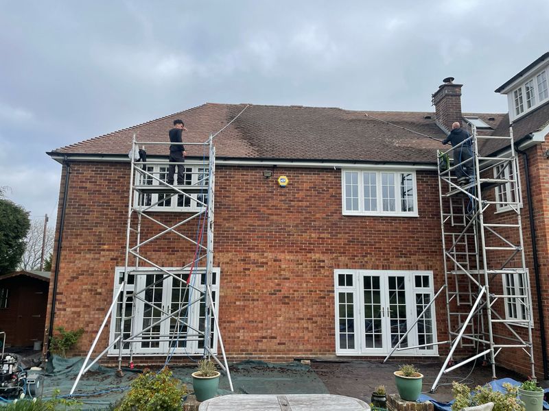 Roof cleaning carried out safely from scaffold towers by The Roof Moss Cleaners in Bracknell